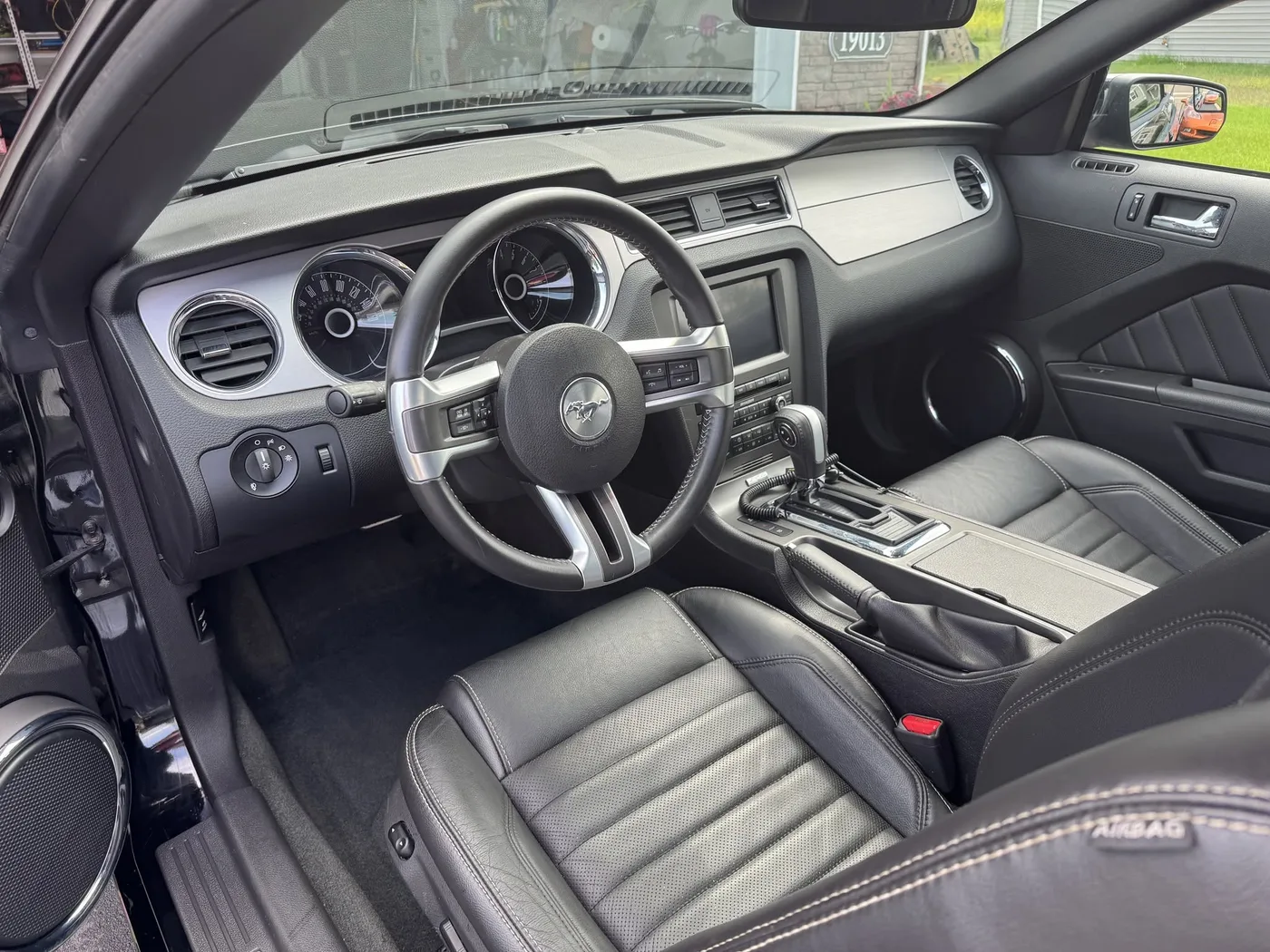 Clean black leather vehicle interior after detailing